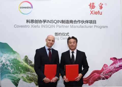 Nick Smith, Global Head of Textile Coatings, Covestro (left), and Xue Taiwen, General Manager and Director of Kunshan Xiefu New Material, after signing-up to the Insqin Partner Manufacturer Program.