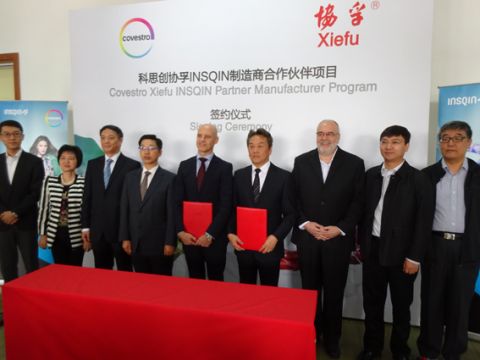 Company officials, representatives and invited dignitaries at the signing ceremony of the Covestro–Xiefu Insqin Partner Manufacturer Program in October 2015.